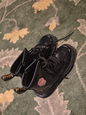 Dr. Martens Kids Black Patent Lace-Up Boots with Pink Flower Patch